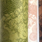 Nepalese handmade decorative lokta paper sheet with a detailed design of trees and flowers in dark green screen printed on a green lokta paper.
