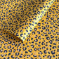 Nepalese handmade decorative lokta paper sheet with an animal print design in two colours, tan and black, screen printed on a yellow lokta paper.
