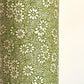 Nepalese handmade decorative lokta paper sheet with a white ditsy floral design screen printed on a green lokta paper.