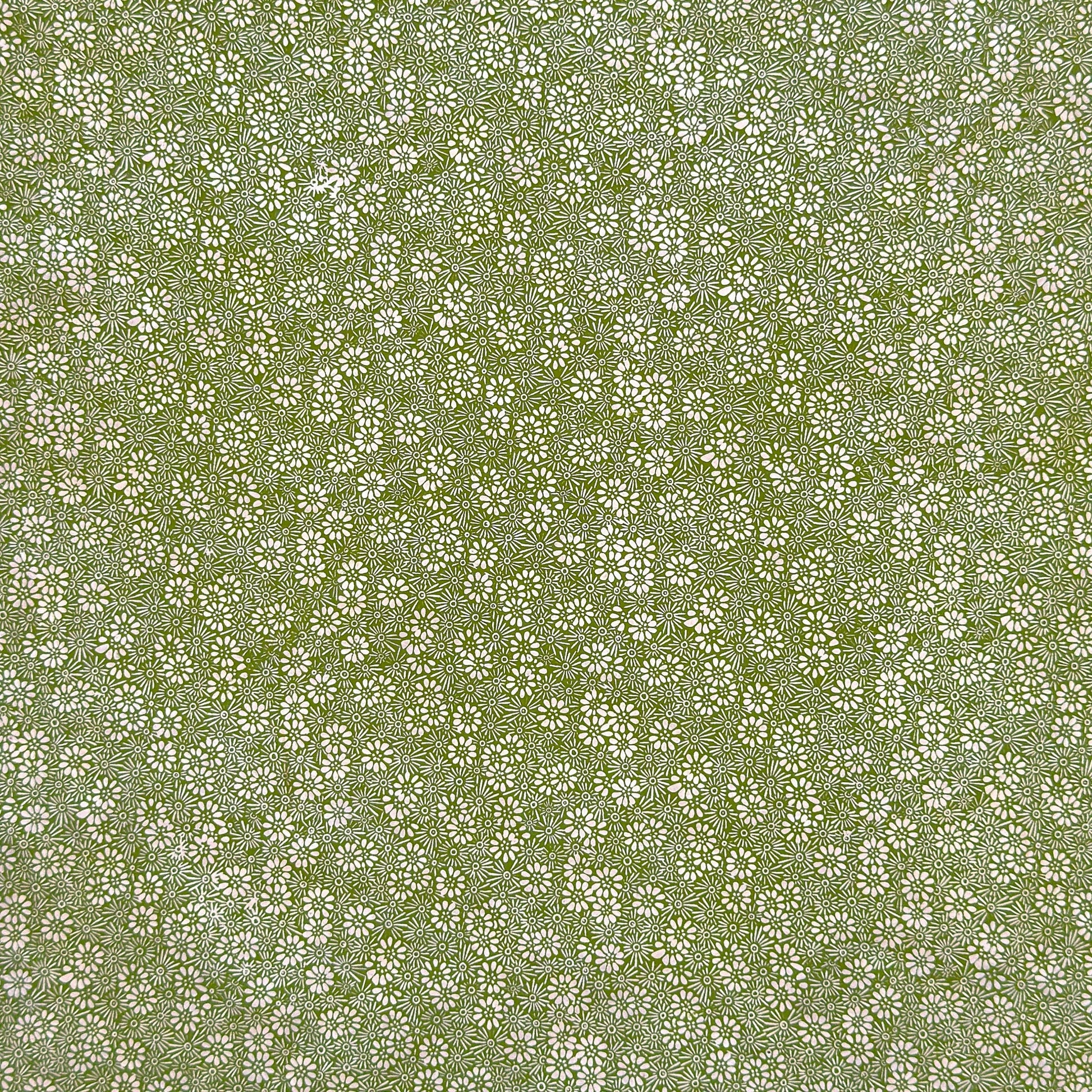 Nepalese handmade decorative lokta paper sheet with a white ditsy floral design screen printed on a green lokta paper.
