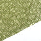 Nepalese handmade decorative lokta paper sheet with a white ditsy floral design screen printed on a green lokta paper.