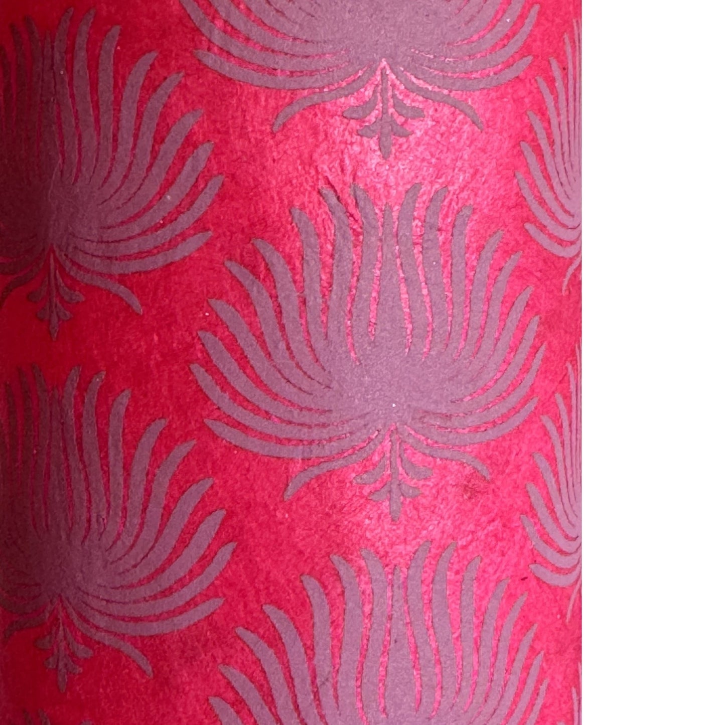 Nepalese handmade decorative lokta paper sheet with a lilac palm leaf design screen printed on a fuchsia pink lokta paper.