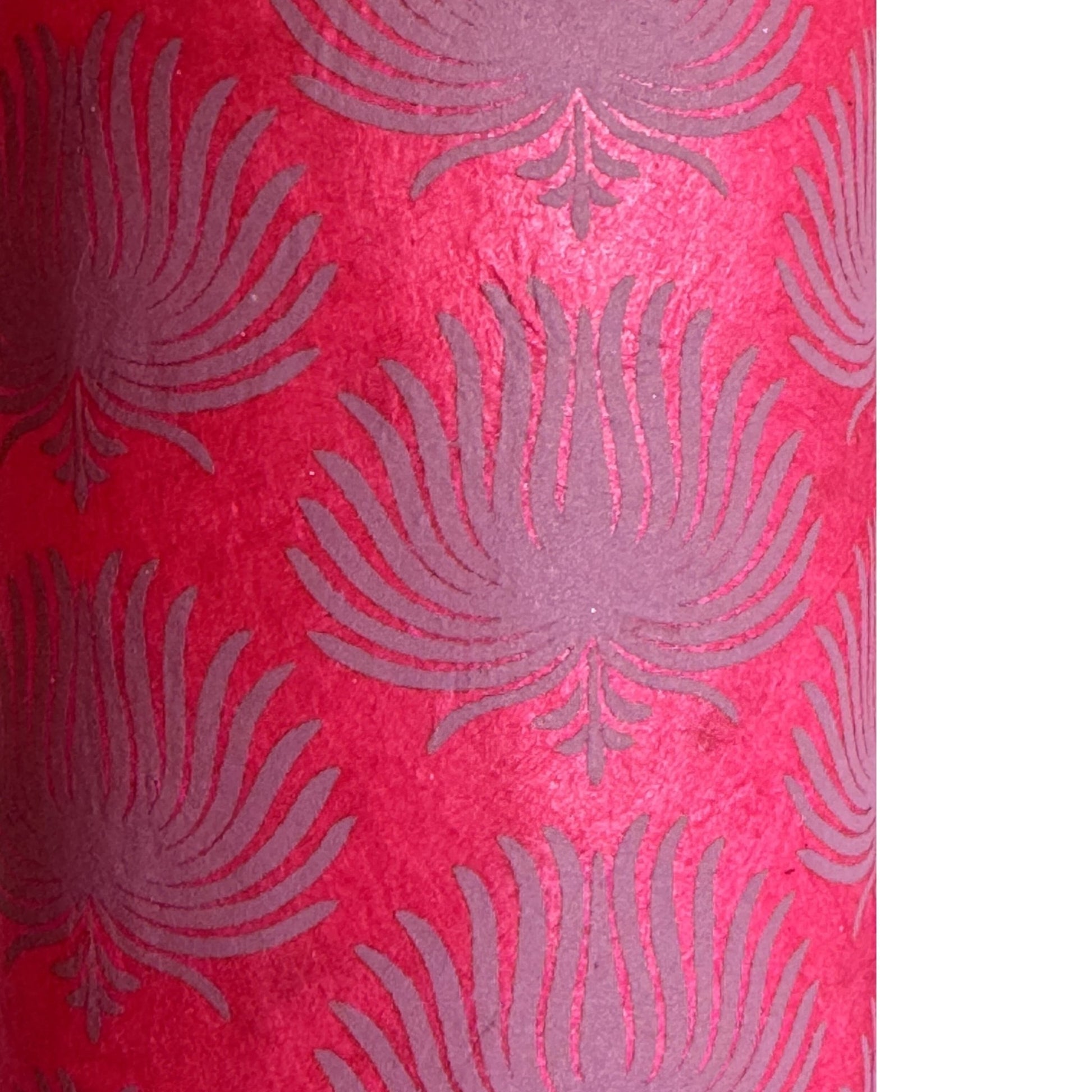 Nepalese handmade decorative lokta paper sheet with a lilac palm leaf design screen printed on a fuchsia pink lokta paper.