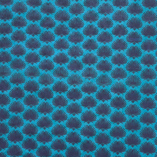 Nepalese handmade decorative lokta paper sheet with an inky blue palm leaf design screen printed on a teal lokta paper.
