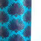 Nepalese handmade decorative lokta paper sheet with an inky blue palm leaf design screen printed on a teal lokta paper. Close up