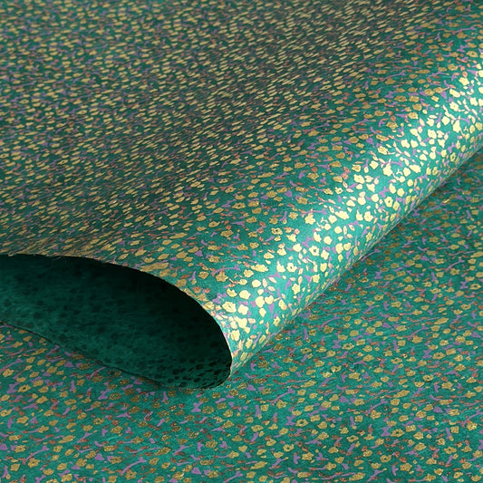 A delicate floral pattern in gold, blush and lilac screen-printed by hand on emerald lokta paper.