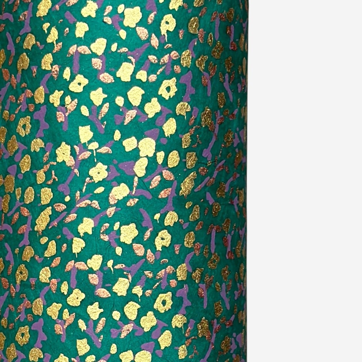 A delicate floral pattern in gold, blush and lilac screen-printed by hand on emerald lokta paper.