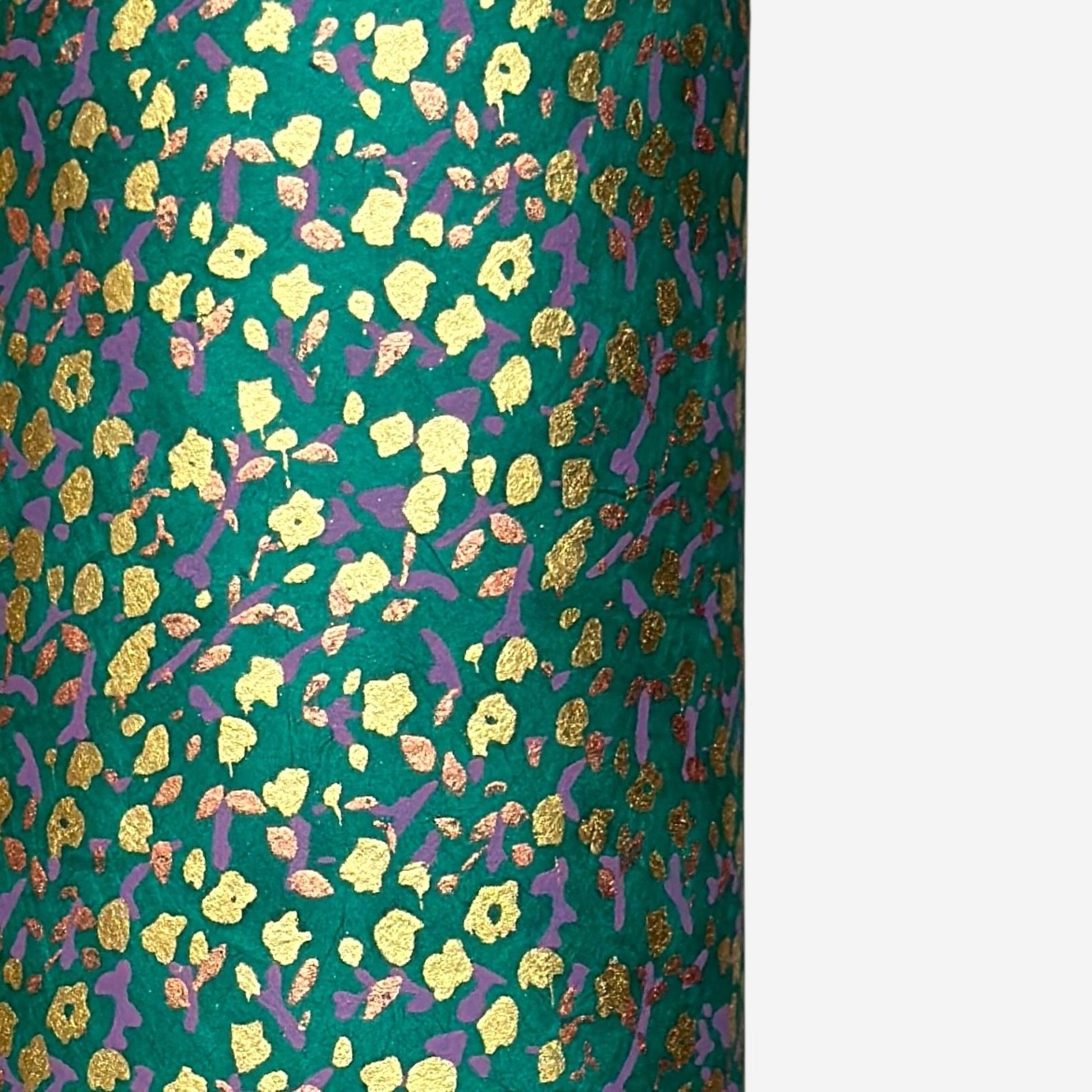 A delicate floral pattern in gold, blush and lilac screen-printed by hand on emerald lokta paper.