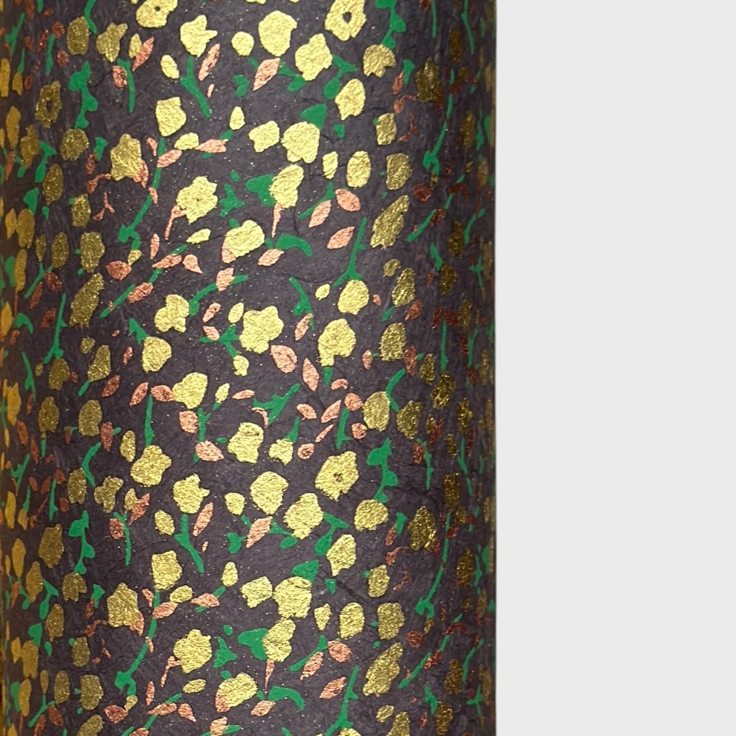 A delicate floral pattern in gold, blush and green screen-printed by hand on slate lokta paper.