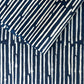 Nepalese handmade decorative lokta paper sheet with a stripe pattern in petrol blue and white.  Batik dyed using carved wooden blocks