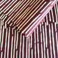 Nepalese handmade decorative lokta paper sheet with a stripe pattern in burgundy and white.  Batik dyed using carved wooden blocks. 