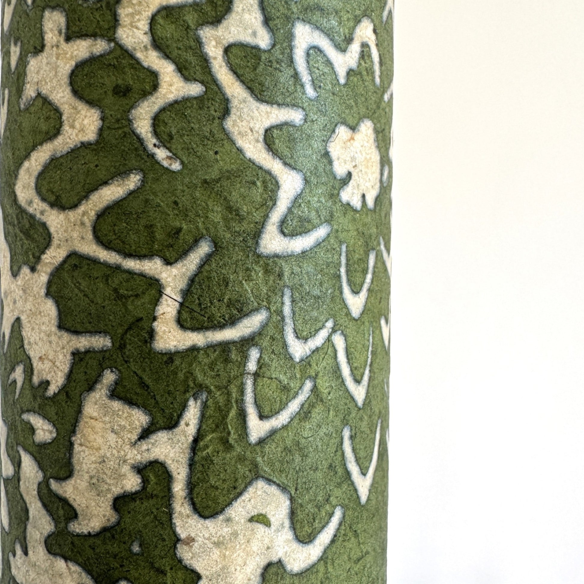 Nepalese handmade decorative lokta paper sheet with a floral pattern in green and cream.  Batik dyed using carved wooden blocks.