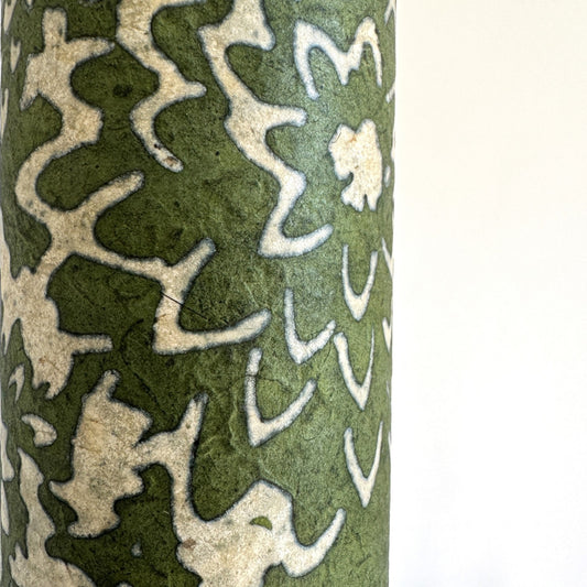 Nepalese handmade decorative lokta paper sheet with a floral pattern in green and cream.  Batik dyed using carved wooden blocks.