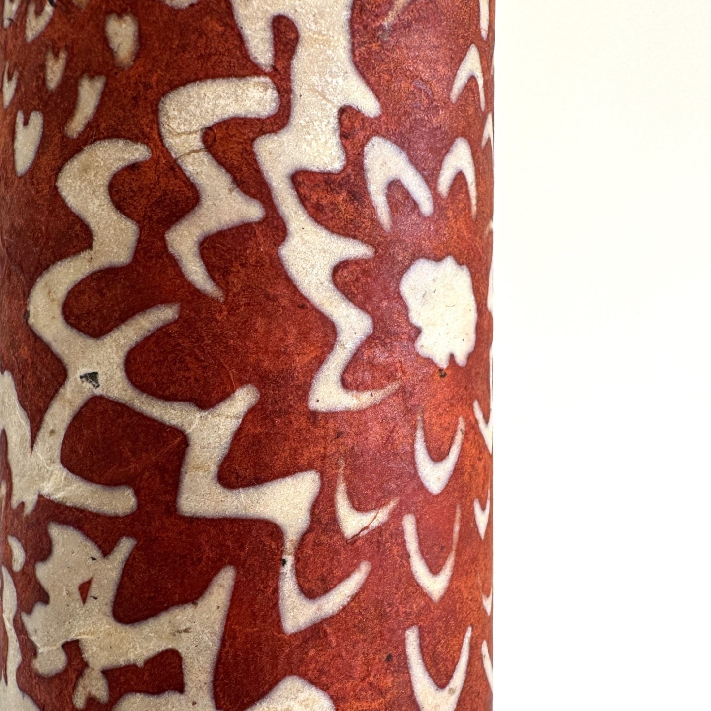 Nepalese handmade decorative lokta paper sheet with a floral pattern in rust and cream.  Batik dyed using carved wooden blocks.