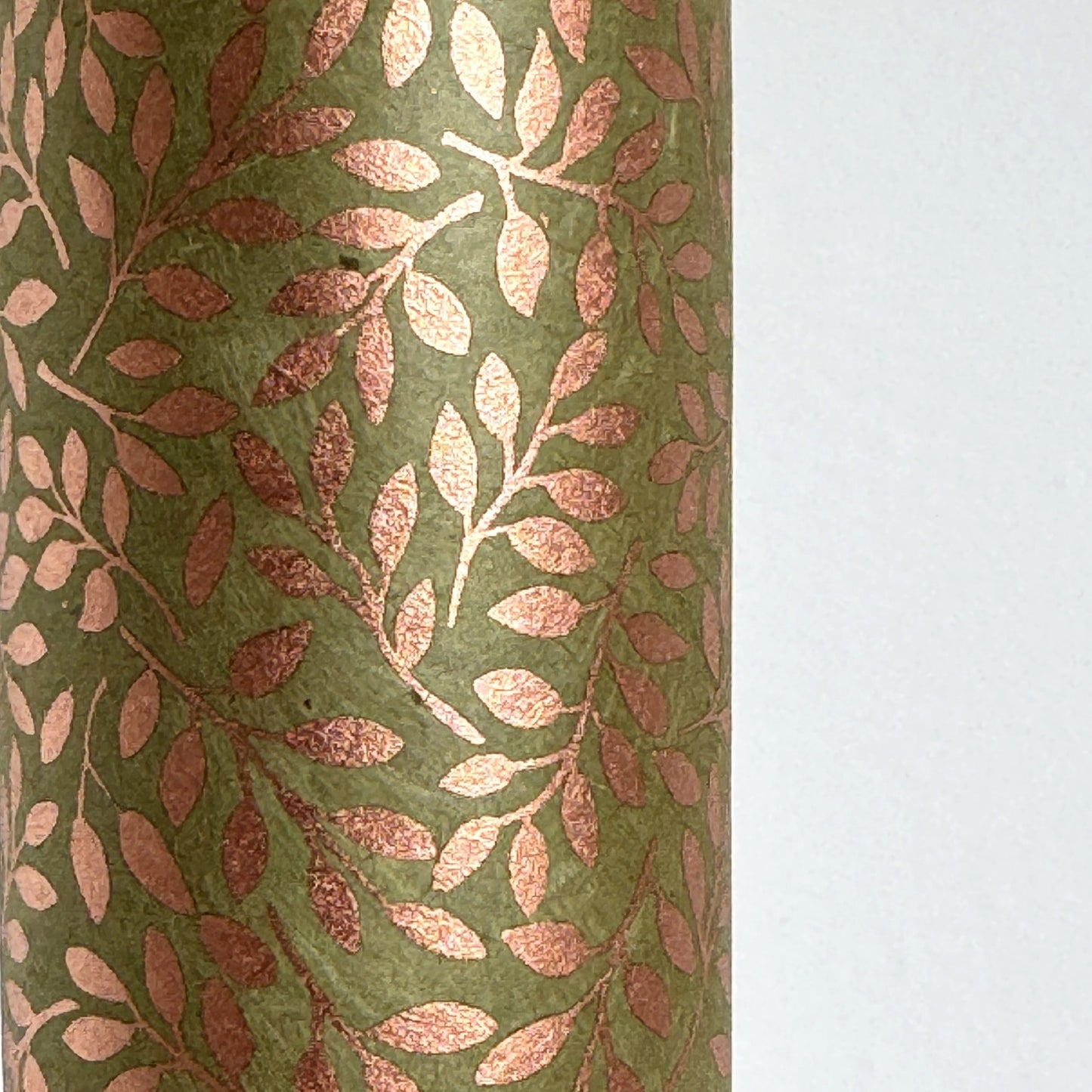 Nepalese handmade decorative lokta paper sheet with a metallic copper willow design screen printed on a dusty moss green lokta paper.