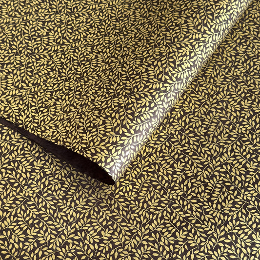 Nepalese handmade decorative lokta paper sheet with a metallic gold willow design screen printed on a dusty grape lokta paper.