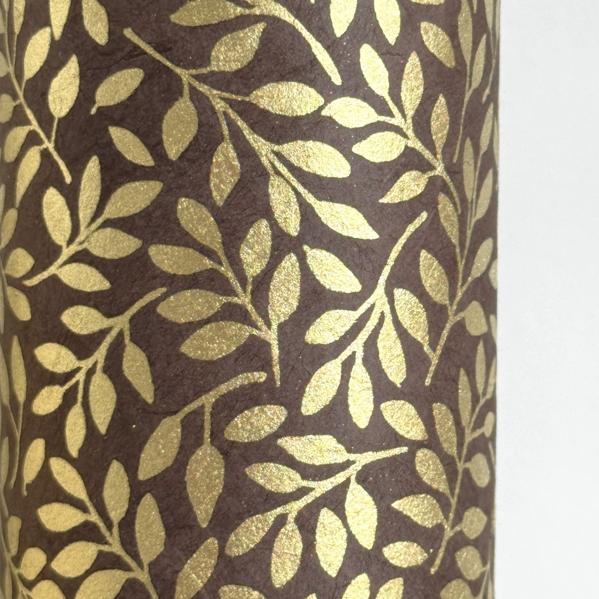 Nepalese handmade decorative lokta paper sheet with a metallic gold willow design screen printed on a dusty grape lokta paper.