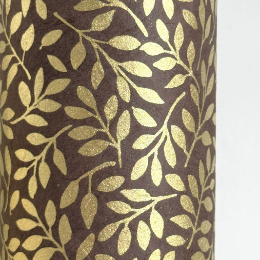 Nepalese handmade decorative lokta paper sheet with a metallic gold willow design screen printed on a dusty grape lokta paper.