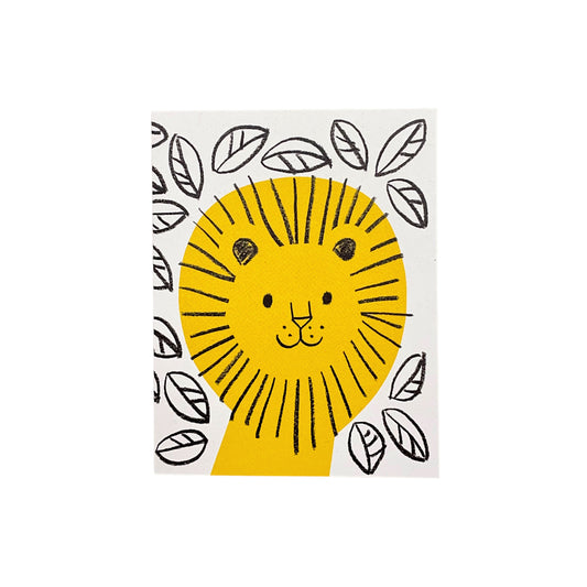 Small greeting card with a drawing of a yellow lion surrounded by black sketched leaves on a white backdrop by Lisa Jones Studio