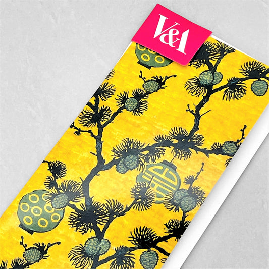 greetings card showing pine branches and lanterns on a deep yellow backdrop