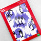 greetings card showing a repeat pattern of black and white penguins with patterned deep lavender backdrop