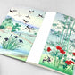 Small stitched notebook with a japanese design showing sparrows and bamboo in the rain
