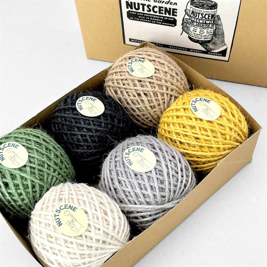 Set of 6 balls of jute twine by Nutscene. Colours are green, black, natural, white, grey and mustard, pictured in gift box