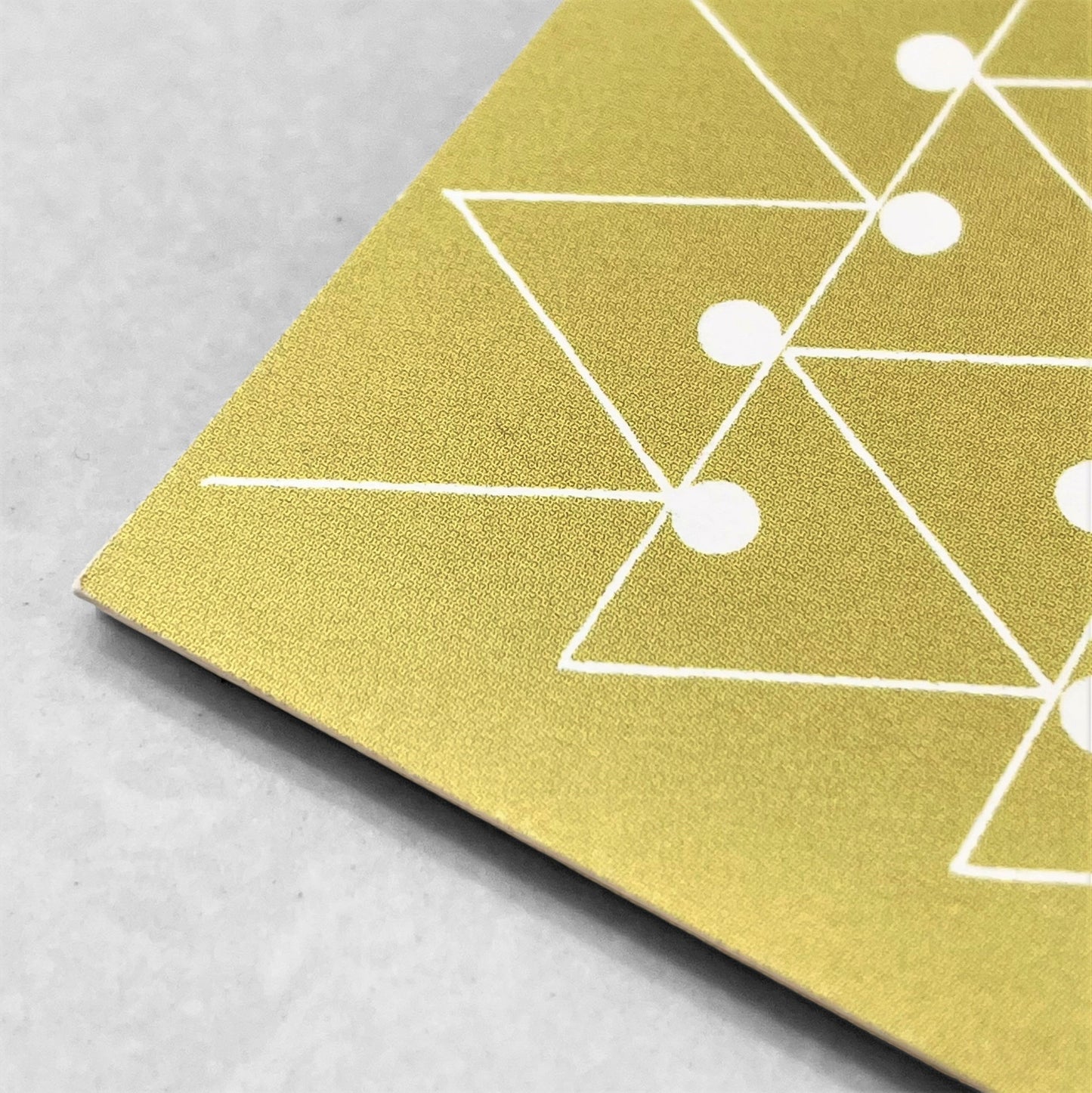 greetings card with abstract triangle and dot pattern in white and mustard by Ola Studio