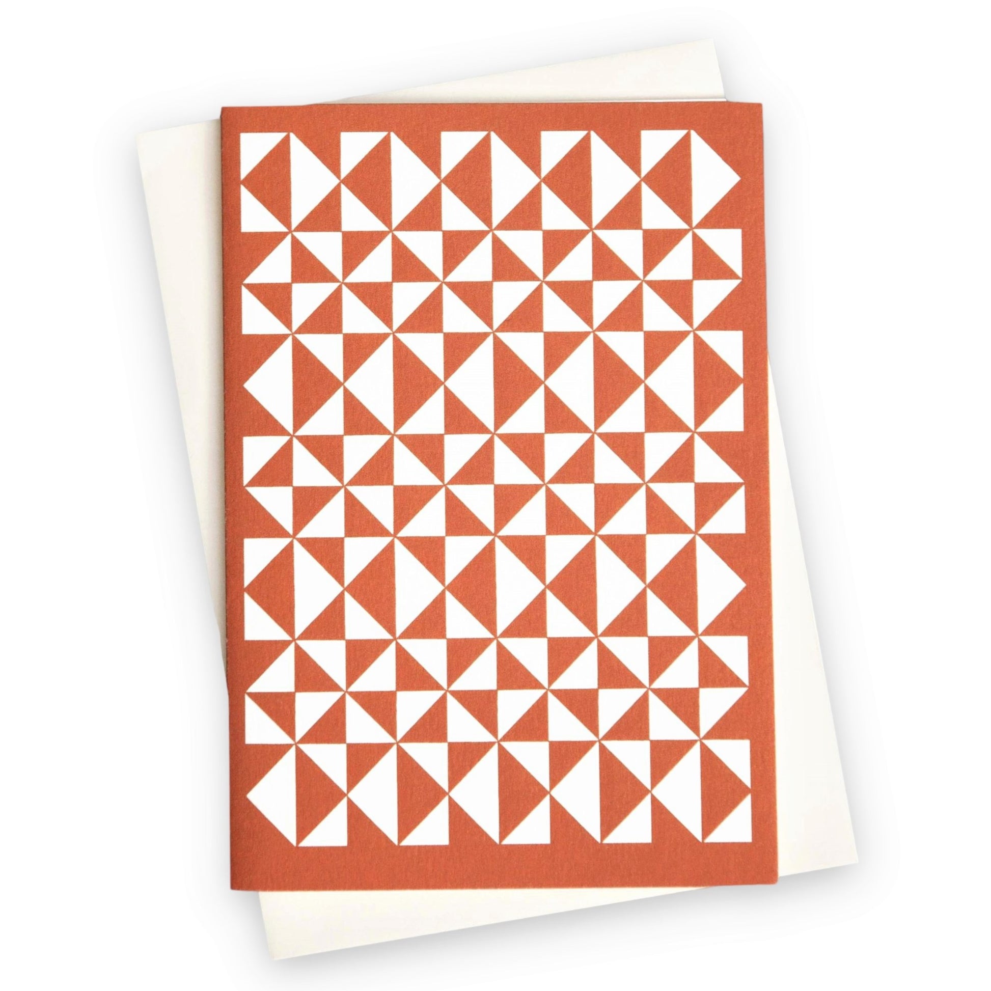greetings card with abstract triangular pattern in white and brick red by Ola Studio