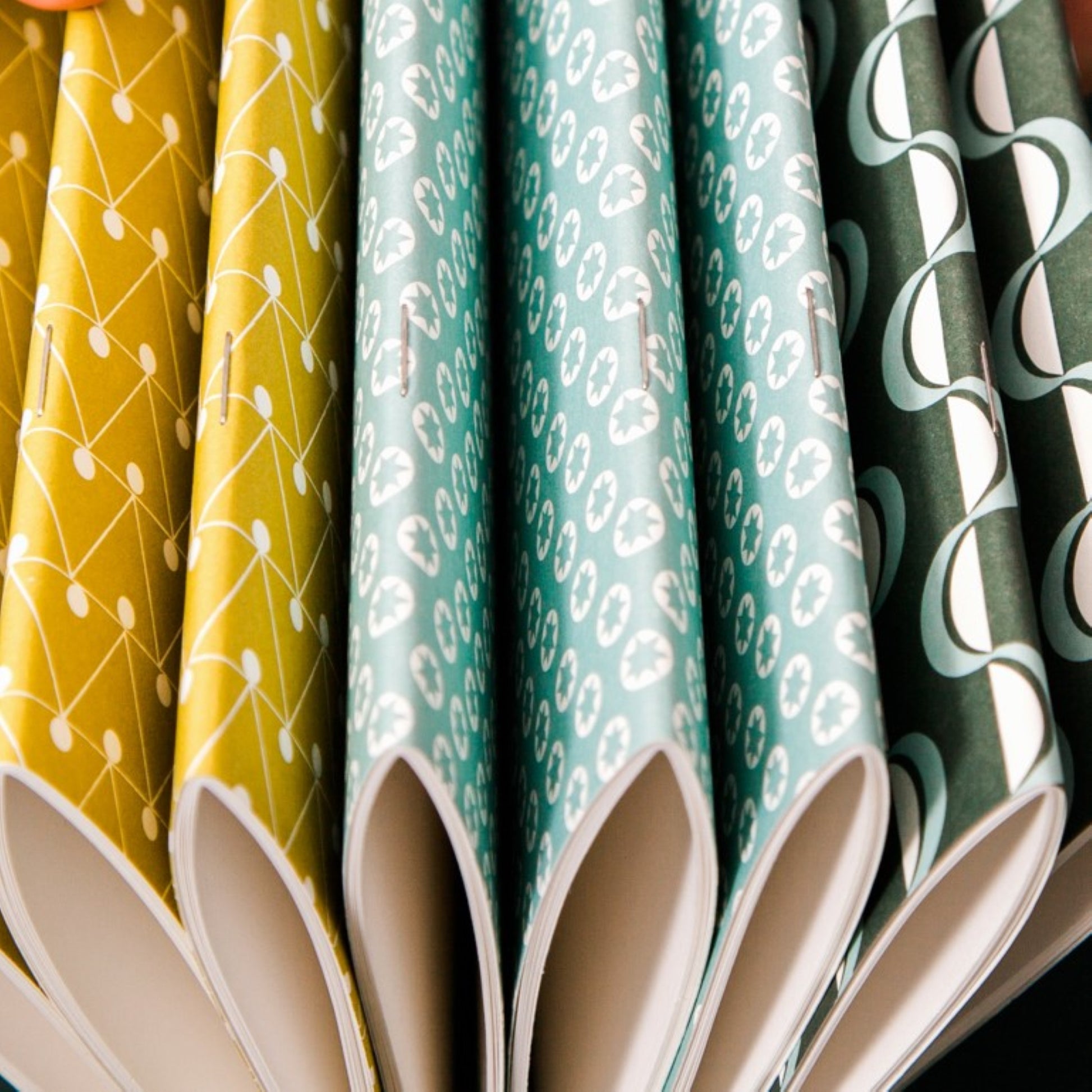 Soft cover pocket notebooks by Ola Studio in different patterned covers