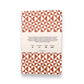 A set of two softcover pocket notebooks by Ola Studio. Two different cover design, one is a circle geometric in pick and orange, the other a triangular geometry in brick red. reverse of packaging pictured