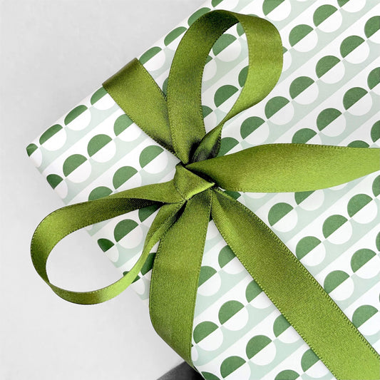 Luxury olive green satin ribbon on a rectangular board by Ola Studio, shown as a bow
