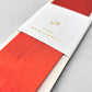 Luxury rust-orange satin ribbon on a rectangular board by Ola Studio