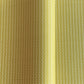 wrapping paper with abstract triangle and dot pattern in mustard and white by Ola Studio