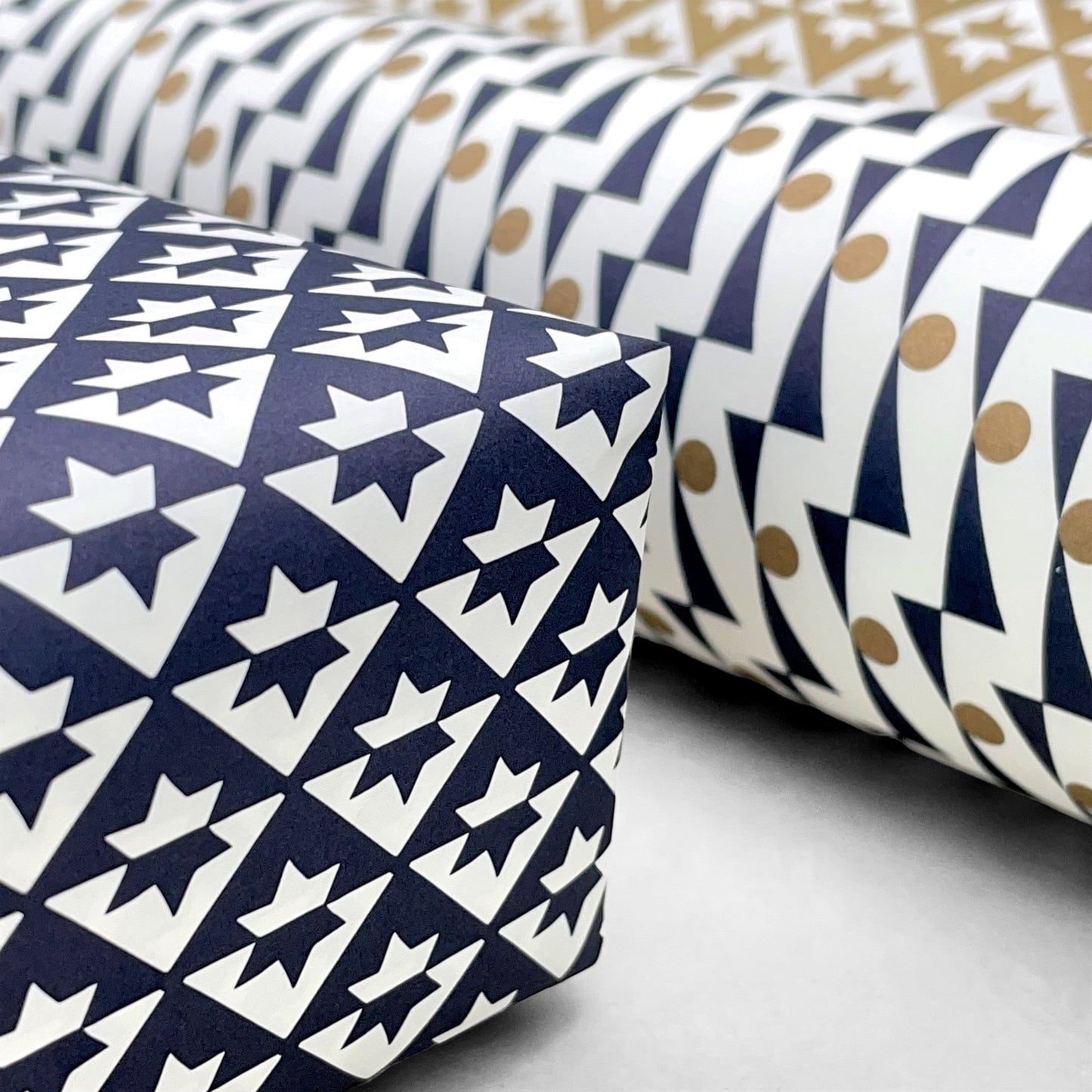 wrapping paper with an abstract star pattern in dark navy and white by Ola Studio