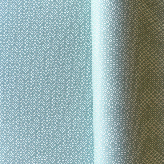wrapping paper with an abstract tiny stars pattern in ice blue and white by Ola Studio