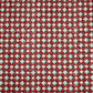 Hand block printed wrapping paper with a floral checked pattern in red, green and gold.