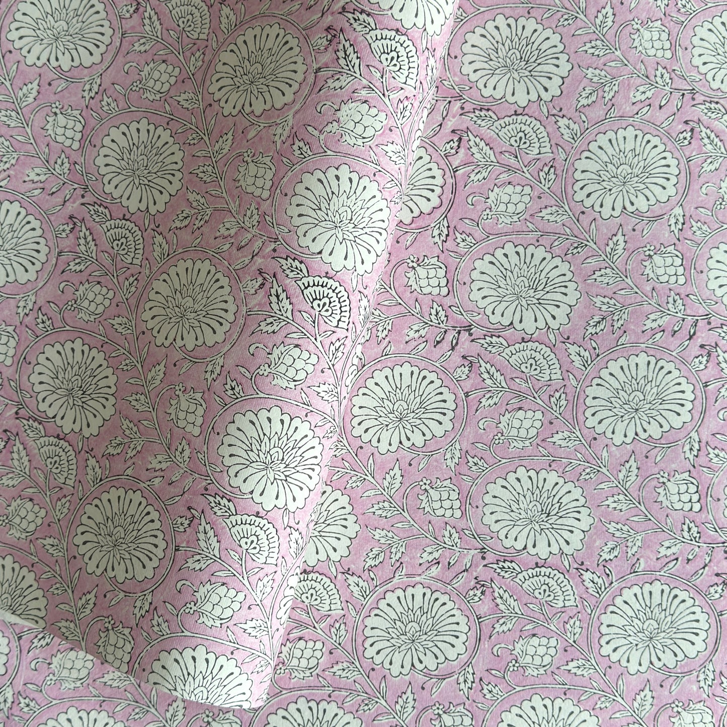 wrapping paper with repeat botanical pattern in pink by Paper Mirchi