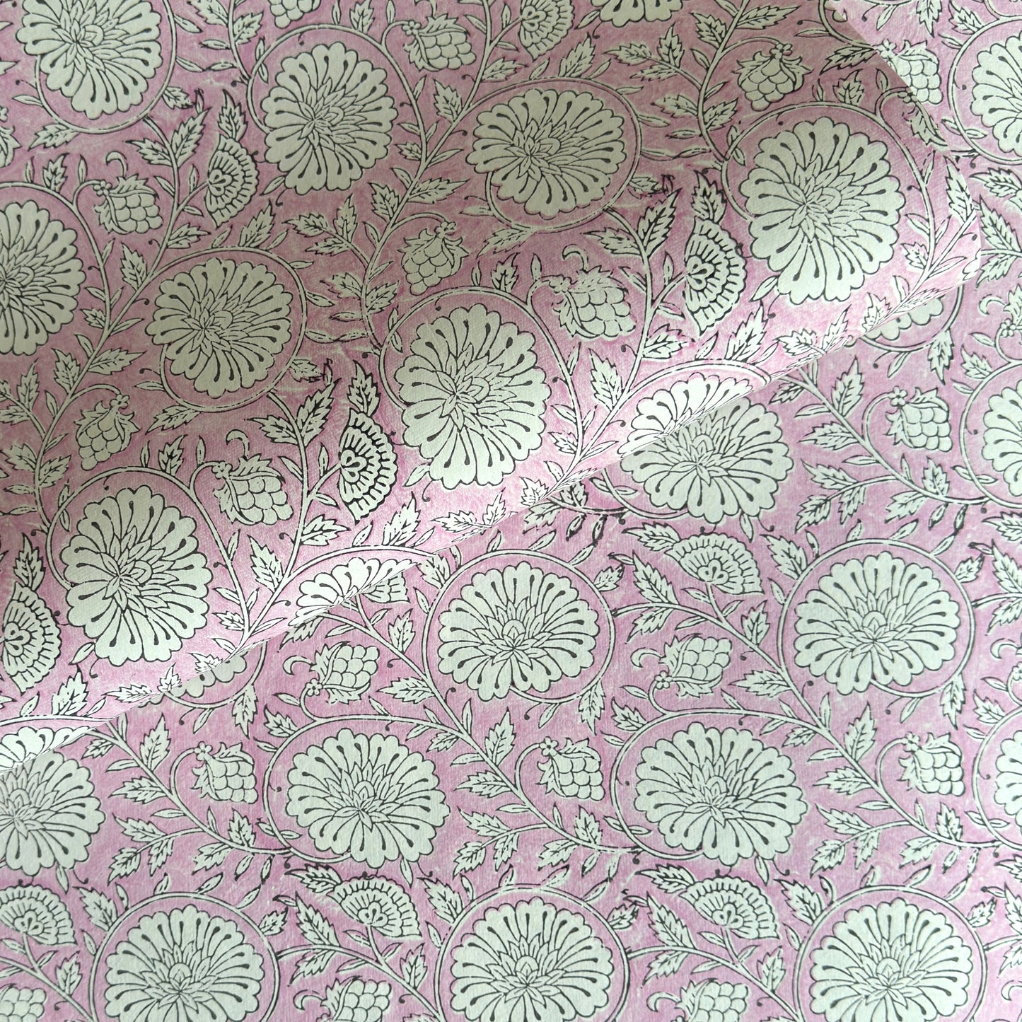 wrapping paper with repeat botanical pattern in pink by Paper Mirchi