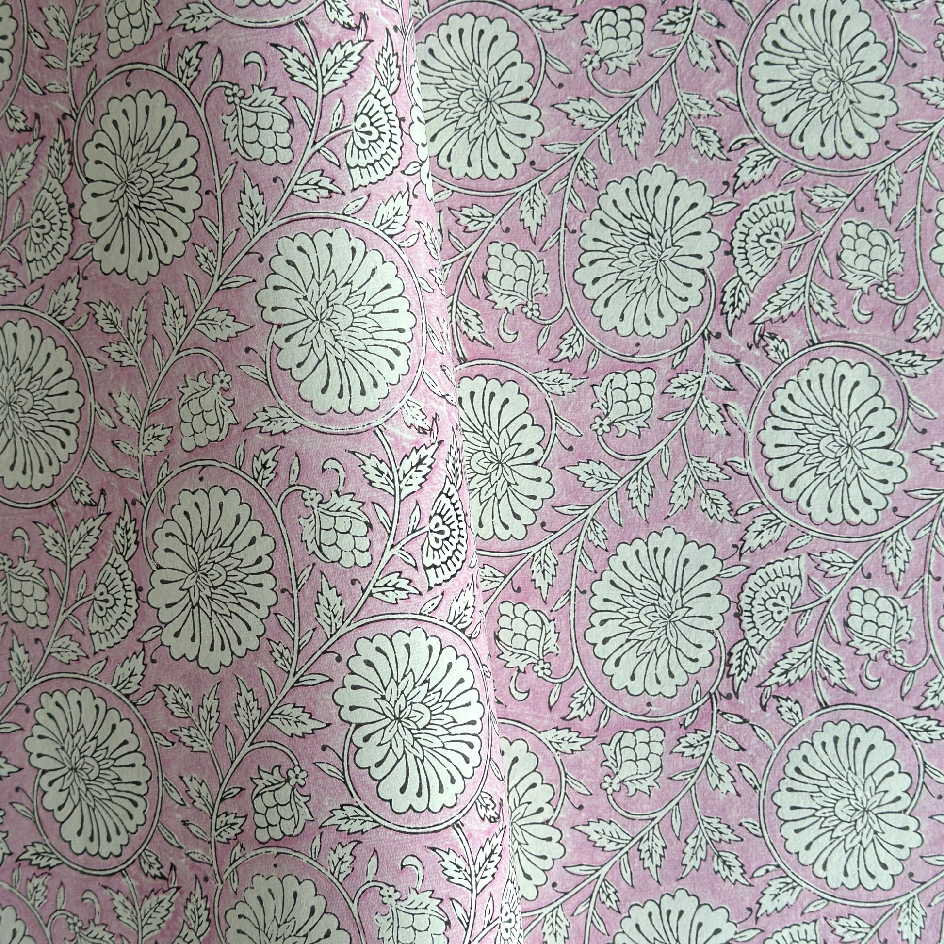 wrapping paper with repeat botanical pattern in pink by Paper Mirchi