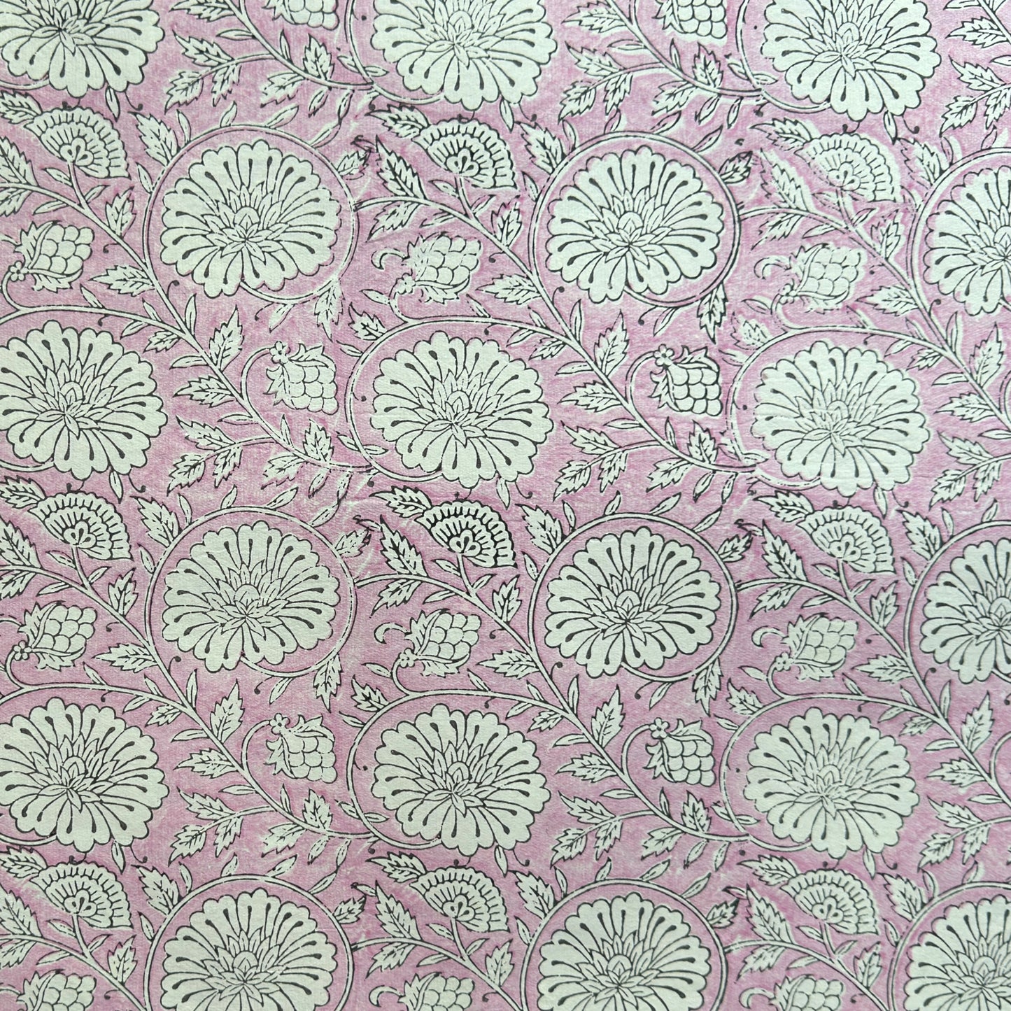 wrapping paper with repeat botanical pattern in pink by Paper Mirchi