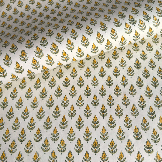 Wrapping paper with block print small flower motif in yellow and green, white background by Paper Mirchi