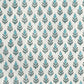 hand block printed wrapping paper by paper mirchi with a repeat floral pattern in turquoise and soft green on white backdrop