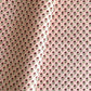 hand block printed patterned paper by Paper Mirchi, red daisy print on pink background