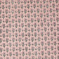 a hand block printed sheet of wrapping paper with a ditsy floral print in pink
