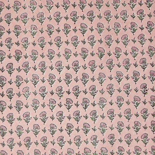 a hand block printed sheet of wrapping paper with a ditsy floral print in pink