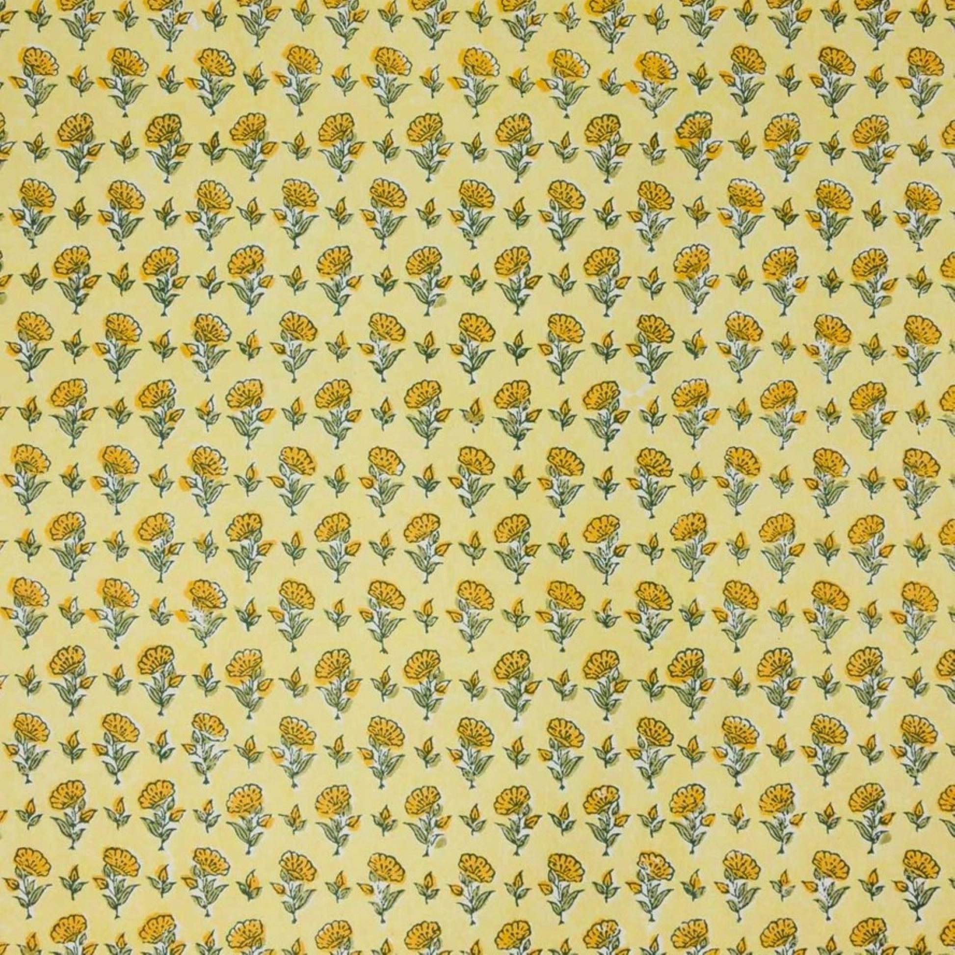 a sheet of hand block printed wrapping paper with a ditsy floral flower design in yellow
