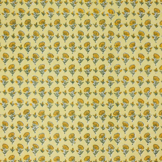 a sheet of hand block printed wrapping paper with a ditsy floral flower design in yellow