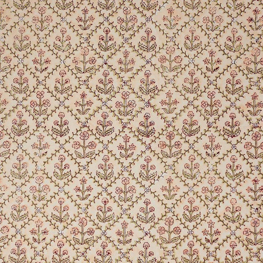 a sheet of hand block printed wrapping paper with a floral trellis design in coral pink and sage green