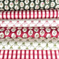 sheets of hand block printed paper in various patterns in red green and wite.  there are gingham, small bows and winter foliage patterns